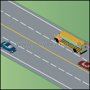 Driving Test Canada - Car Test 2 - At what point are you allowed to continue to drive passed a school bus whose flashing lights and warning device are activated and you are driving toward the school bus from the front?